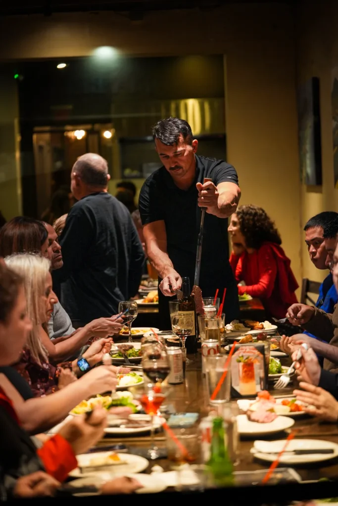 Group of friends having a wonderful dinner gathering at By Brazil Restaurant