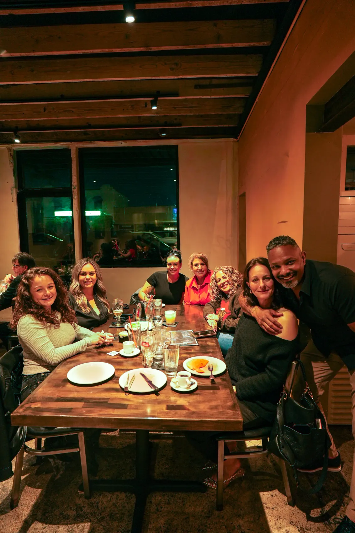 Lively atmosphere with guests enjoying meals at By Brazil Restaurant