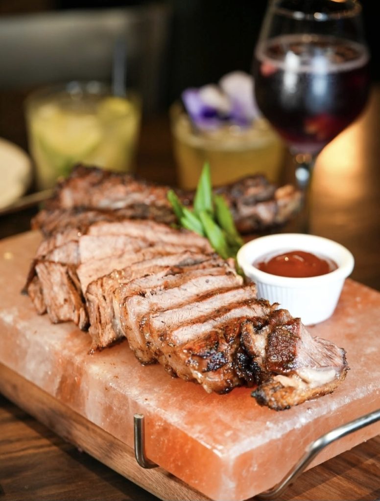 cutting board with sliced meat on it